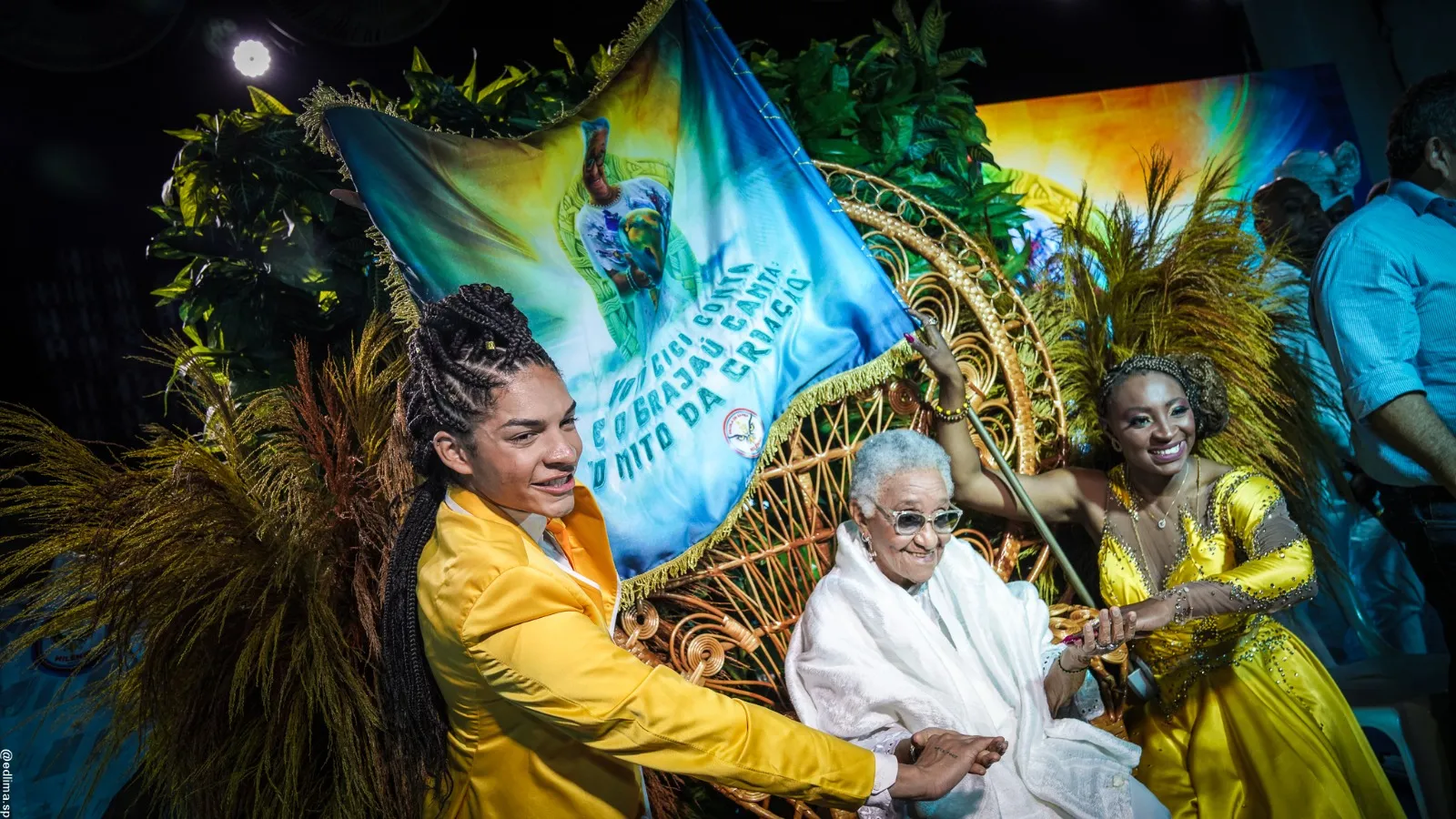 Milênio apresenta enredo 2024 sobre o mito da criação Iorubá através da sabedoria ancestral da Vovó Cici de Oxalá